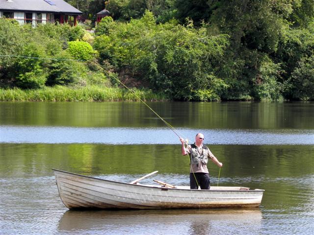photo of man fishing